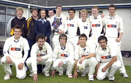 Robbie Kirk, captain of the RBAI senior cricket team with Vicki Bates, Ulster Bank,and team mates after they had defeated the Belfast High School in the final of the Ulster Bank School cup final at Muckamore.
