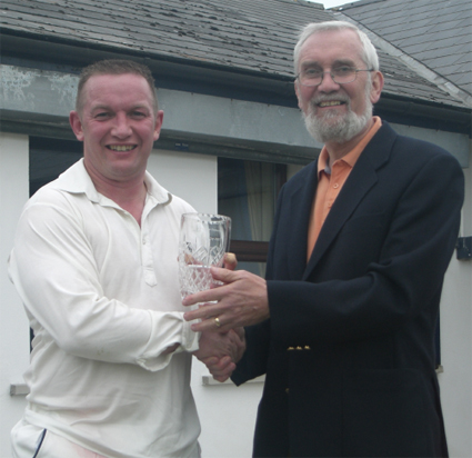 Saintfield's Ray McCavery receives his MOM award from NCU President Ivan Anderson