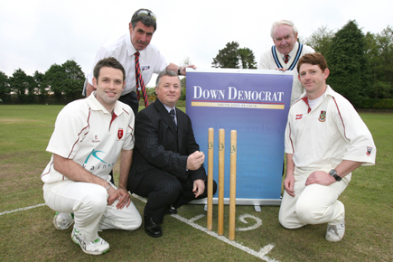 Keiran Moloney, CEO TCH Democrat Media tosses up at start of 2nd round match between Dundrum and Cliftonville with left Rodney Hassard, Dundrum and right Brian Anderson, Cliftonville, with umpires Noel McCarey and Sylvan Reid in the background